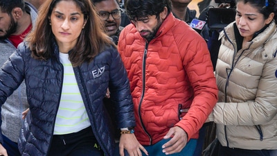Wrestlers Vinesh Phogat, Sakshi Malik and Bajrang Punia protest against the Wrestling Federation of India (WFI), at Jantar Mantar in New Delhi. (PTI) Wrestlers Vinesh Phogat, Sakshi Malik and Bajrang Punia protest against the Wrestling Federation of India (WFI), at Jantar Mantar in New Delhi. (PTI)