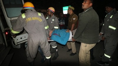 Fire service personnel carry injured to ambulance after a multi-storey building collapsed in Lucknow. (Deepak Gupta/HT Photo) Fire service personnel carry injured to ambulance after a multi-storey building collapsed in Lucknow. (Deepak Gupta/HT Photo)