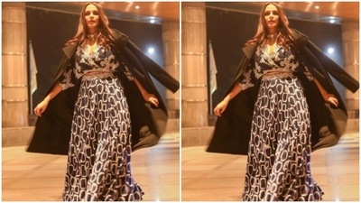 Neha added more oomph to her look with a long and flowy blue skirt featuring patterns in shades of white. In a black trench coat styled on her shoulders, she gave us inspo on how to style an ethnic ensemble with a winterwear. (Instagram/@nehadhupia) Neha added more oomph to her look with a long and flowy blue skirt featuring patterns in shades of white. In a black trench coat styled on her shoulders, she gave us inspo on how to style an ethnic ensemble with a winterwear. (Instagram/@nehadhupia)