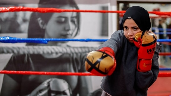 A young Palestinian girl warms up during a training session inside the first women's boxing center in Gaza City, on January 17. Boxing has helped young women find a release from the daily stresses of life in Gaza, a narrow coastal strip where some 2.3 million Palestinians live blockaded by both Israel and neighbouring Egypt.&nbsp;(Mohammed Salem / REUTERS)
