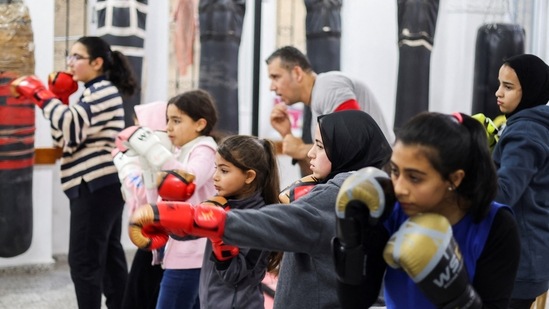 Young Palestinian women work on boxing moves during a training session at the Palestine Boxing Center, on January 17. (Mohammed Salem / REUTERS)