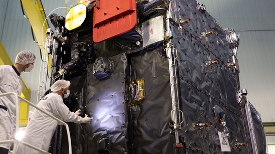 Engineers work around the ESA's (European Space Agency) "Juice" probe during its unveiling for media.(AFP)