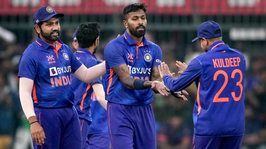 Indian bowler Hardik Pandya celebrates with teammates Rohit Sharma and Kuldeep Yadav after the wicket of New Zealand's batter Finn Allen(PTI)