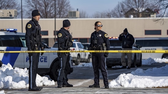 Law enforcement officers stand outside a school housing an educational program called Starts Right Here that is affiliated with the Des Moines school district, following a shooting Monday, Jan. 23, 2023, in Des Moines, Iowa.(AP)