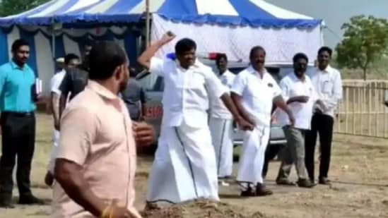 Tamil Nadu Minister SM Nasar throws a stone at party workers in Tiruvallur,(Twitter)