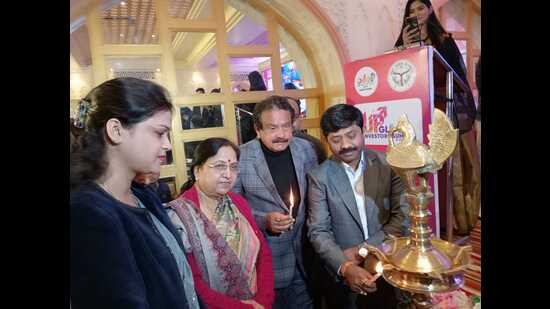 U.P. cabinet minister Nand Gopal Gupta ‘Nandi’ (extreme right) lighting the lamp at investors’ summit in Agra. (HT photo)