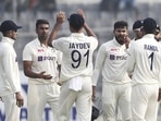 India's Ravichandran Ashwin, second left, celebrates with teammates