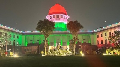 Supreme Court illuminated in Tricolour on the eve of Republic Day. (ANI)