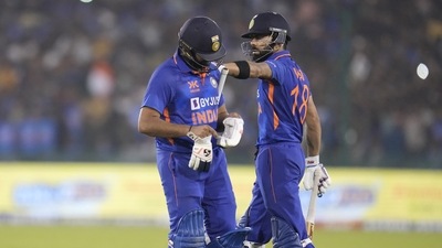 India's captain Rohit Sharma, left, receives a pat on his back from teammate Virat Kohli (AP)