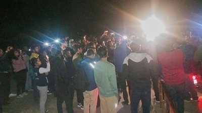 Students stand outside the JNUSU office alleging that the JNU administration has cut off electricity supply to prevent the screening of BBC documentary on Tuesday, (PTI) Students stand outside the JNUSU office alleging that the JNU administration has cut off electricity supply to prevent the screening of BBC documentary on Tuesday, (PTI)