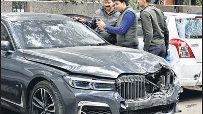 Police officials take a look at the BMW car involved in a hit-and-run accident in south Delhi’s Munirka area on Tuesday. A local pushcart vendor was killed in the accident. (Vipin Kumar/HT photo) Police officials take a look at the BMW car involved in a hit-and-run accident in south Delhi’s Munirka area on Tuesday. A local pushcart vendor was killed in the accident. (Vipin Kumar/HT photo)
