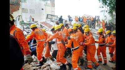 Rescue operation underway after the collapse of a four-storey residential building in the Hazratganj area, in Lucknow on Wednesday. (PTI) Rescue operation underway after the collapse of a four-storey residential building in the Hazratganj area, in Lucknow on Wednesday. (PTI)