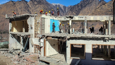 NDRF and SDRF personnel demolish the Hotel Mount View, which has been marked unsafe, in the land subsidence affected area in Joshimath. (PTI) NDRF and SDRF personnel demolish the Hotel Mount View, which has been marked unsafe, in the land subsidence affected area in Joshimath. (PTI)