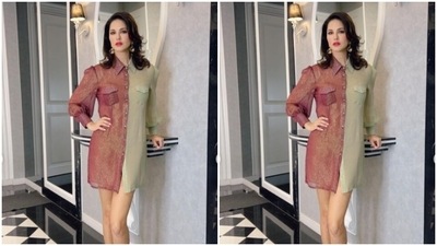 Sunny looked weekend-ready in the maroon and ivory white shirt dress featuring full sleeves, collars and divided patterns. The short silk dress hugged her shape and showed off her curves perfectly. (Instagram/@sunnyleone) Sunny looked weekend-ready in the maroon and ivory white shirt dress featuring full sleeves, collars and divided patterns. The short silk dress hugged her shape and showed off her curves perfectly. (Instagram/@sunnyleone)
