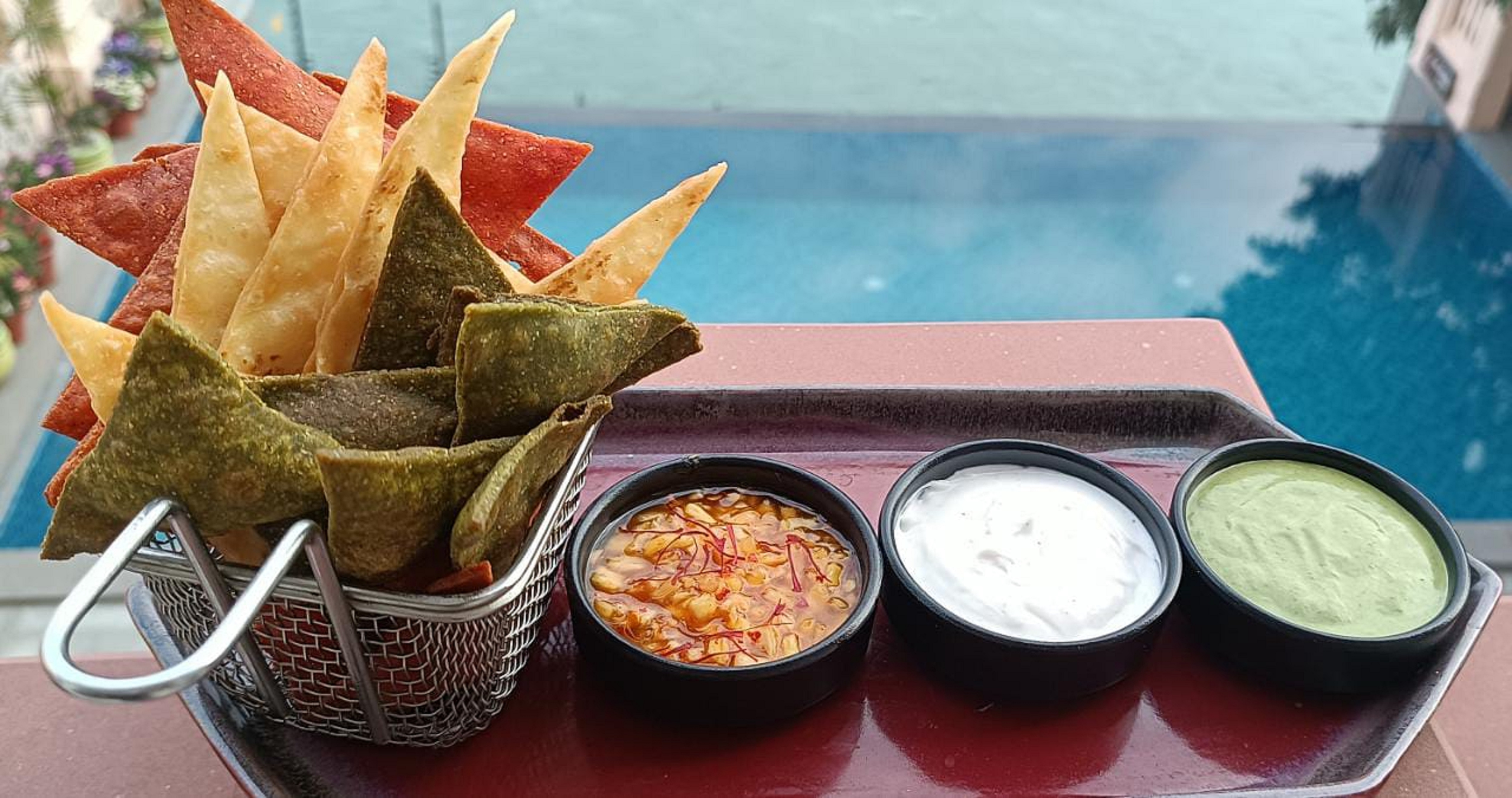 Tricolour mix millets (Jowar n Bajra) nachos crisp with tri flavour dip (Pilibhit House)