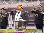 Prime Minister Narendra Modi with Chief of Defence Staff General Anil Chauhan and Chief of Naval Staff Admiral R Hari Kumar pays homage at the National War Memorial on the occasion of 74th Republic Day in New Delhi.(PTI)