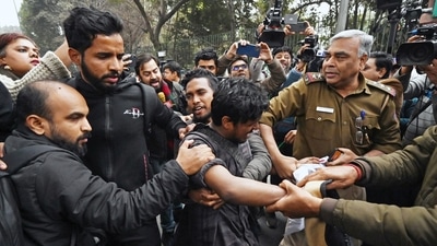 New Delhi, Jan 25 (ANI): Students being detained for sloganeering outside Jamia Millia University over the campus authorities not allowing the screening of a BBC documentary on PM Narendra Modi, in New Delhi on Wednesday. (ANI Photo) (ANI)
