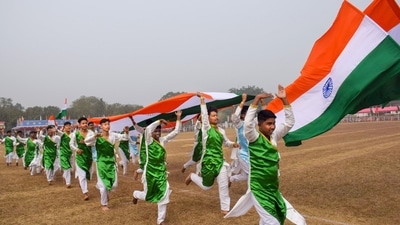 School students holding the Tri-colour take part in the 74th Republic Day function in Agartala. (PTI) School students holding the Tri-colour take part in the 74th Republic Day function in Agartala. (PTI)