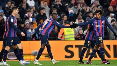 Barcelona's French forward Ousmane Dembele (C) celebrates with Barcelona's French defender Jules Kounde (R) scoring his team's first goal during the Copa del Rey (King's Cup), quarter final football match between FC Barcelona and Real Sociedad, at the Camp Nou stadium in Barcelona on January 25, 2023. (Photo by Pau BARRENA / AFP) (AFP) Barcelona's French forward Ousmane Dembele (C) celebrates with Barcelona's French defender Jules Kounde (R) scoring his team's first goal during the Copa del Rey (King's Cup), quarter final football match between FC Barcelona and Real Sociedad, at the Camp Nou stadium in Barcelona on January 25, 2023. (Photo by Pau BARRENA / AFP) (AFP)