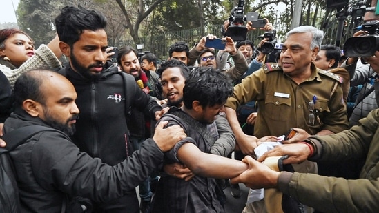 New Delhi, Jan 25 (ANI): Students being detained for sloganeering outside Jamia Millia University over the campus authorities not allowing the screening of a BBC documentary on PM Narendra Modi, in New Delhi on Wednesday. (ANI Photo)(ANI)