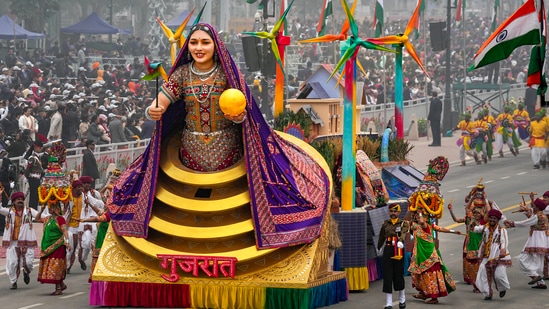 Kutchi embroidery and decoration known for its mirror work, traditional 'bhungas' and renewable energy production are the focus elements in the tableau of Gujarat that rolled down the Kartavya Path during the Republic Day celebrations.(PTI)