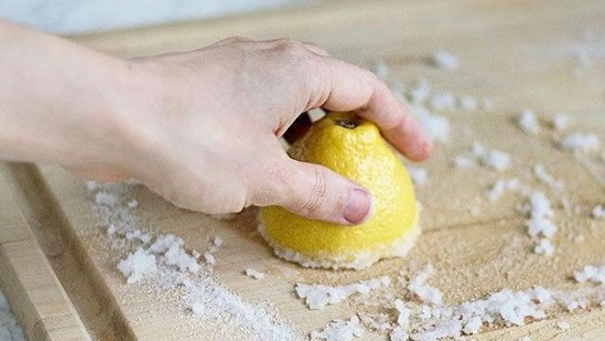 Salt and Lemon Juice for Cleaning Cutting Boards Finally, salt and lemon juice can be used to clean cutting boards. Sprinkle salt on a cutting board, cut a lemon in half and rub it over the salt, rub with the lemon-salt mixture, and rinse with hot water. Repeat as needed to get a fresh, sanitized cutting board.