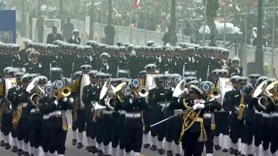 Brass band of the Indian Navy comprising 80 musicians play 'Jai Bharti' while marching down Kartavya Path. (ANI)