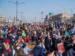 Followers of the Shiite cleric Muqtada al-Sadr raise the Quran, the Muslim holy book, in response to the burning of a copy of the Quran in Sweden, during open-air Friday prayers in Baghdad, Iraq.(AP) Followers of the Shiite cleric Muqtada al-Sadr raise the Quran, the Muslim holy book, in response to the burning of a copy of the Quran in Sweden, during open-air Friday prayers in Baghdad, Iraq.(AP)