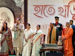 West Bengal Governor C.V. Ananda Bose, Chief Minister Mamata Banerjee, musician Puran Das Baul and others sing during the 'Hatey Khari' event at Raj Bhavan in Kolkata. West Bengal Governor C.V. Ananda Bose, Chief Minister Mamata Banerjee, musician Puran Das Baul and others sing during the 'Hatey Khari' event at Raj Bhavan in Kolkata.