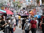 Tourists walk along rows of shops in Chinatown in Singapore January 27, 2023. 