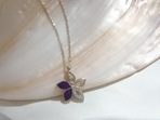 A flower pendant necklace looks dainty and elevates the look.