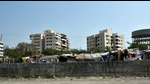 The residents of Rhythm Housing Society, Wakad, have entreated the PMRDA to relocate the slums that have come up on the open land next to the society (HT PHOTO) The residents of Rhythm Housing Society, Wakad, have entreated the PMRDA to relocate the slums that have come up on the open land next to the society (HT PHOTO)
