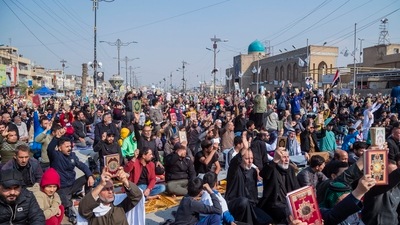 Followers of the Shiite cleric Muqtada al-Sadr raise the Quran, the Muslim holy book, in response to the burning of a copy of the Quran in Sweden, during open-air Friday prayers in Baghdad, Iraq. (AP) Followers of the Shiite cleric Muqtada al-Sadr raise the Quran, the Muslim holy book, in response to the burning of a copy of the Quran in Sweden, during open-air Friday prayers in Baghdad, Iraq. (AP)