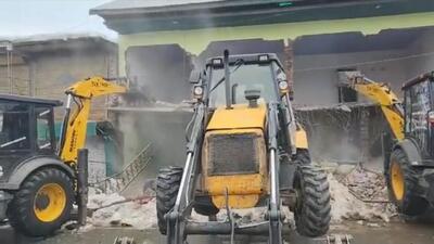 Bulldozers in action at the main square, Shopian, on Friday. (Screengrab) Bulldozers in action at the main square, Shopian, on Friday. (Screengrab)