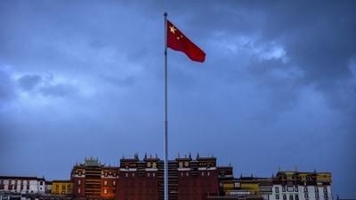 The Chinese flag flies at a plaza near the Potala Palace in Lhasa in western China's Tibet Autonomous Region. (AP) The Chinese flag flies at a plaza near the Potala Palace in Lhasa in western China's Tibet Autonomous Region. (AP)