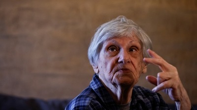 92-year-old Holocaust survivor and Ukrainian refugee from Kyiv, Iya Rudzitskaya, gestures during an interview in Krakow, Poland. (REUTERS)