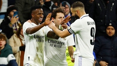 Real Madrid's Vinicius Junior celebrates scoring their third goal with Karim Benzema and a teammate (REUTERS)