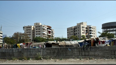 The residents of Rhythm Housing Society, Wakad, have entreated the PMRDA to relocate the slums that have come up on the open land next to the society (HT PHOTO) The residents of Rhythm Housing Society, Wakad, have entreated the PMRDA to relocate the slums that have come up on the open land next to the society (HT PHOTO)