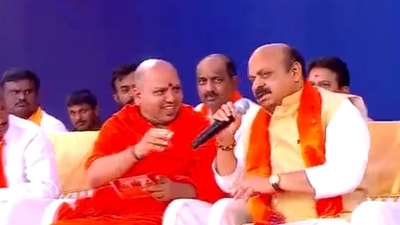 CM Bommai grabs mic from a seer while calling out civic menace in B'luru. Watch (Screen grab from the video) CM Bommai grabs mic from a seer while calling out civic menace in B'luru. Watch (Screen grab from the video)