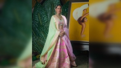 Masaba Gupta wore a barfi pink 'paan-patti' lehenga which she paired with two dupattas - one in lime green wallflower print dupatta with a sequinned border and the other with 'open hearts' embellished on it in rani pink. (Instagram/@masabagupta) Masaba Gupta wore a barfi pink 'paan-patti' lehenga which she paired with two dupattas - one in lime green wallflower print dupatta with a sequinned border and the other with 'open hearts' embellished on it in rani pink. (Instagram/@masabagupta)