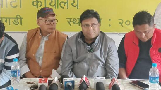 GJM general secretary Roshan Giri (in grey jacket)addressing media persons. (HT photo)