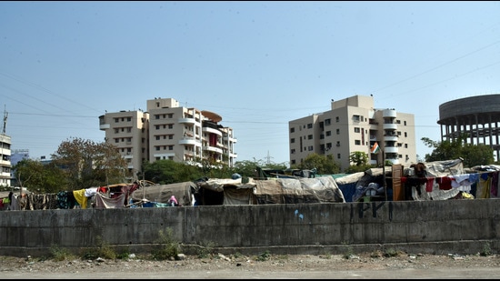 The residents of Rhythm Housing Society, Wakad, have entreated the PMRDA to relocate the slums that have come up on the open land next to the society (HT PHOTO) The residents of Rhythm Housing Society, Wakad, have entreated the PMRDA to relocate the slums that have come up on the open land next to the society (HT PHOTO)
