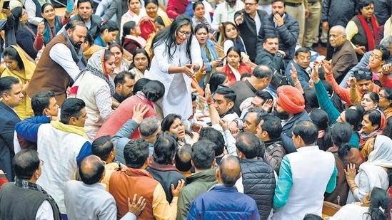 AAP and BJP Delhi councillors shout slogans during the oath ceremony at the MCD Civic Centre in New Delhi on January 24. (Raj K Raj/HT Photo)