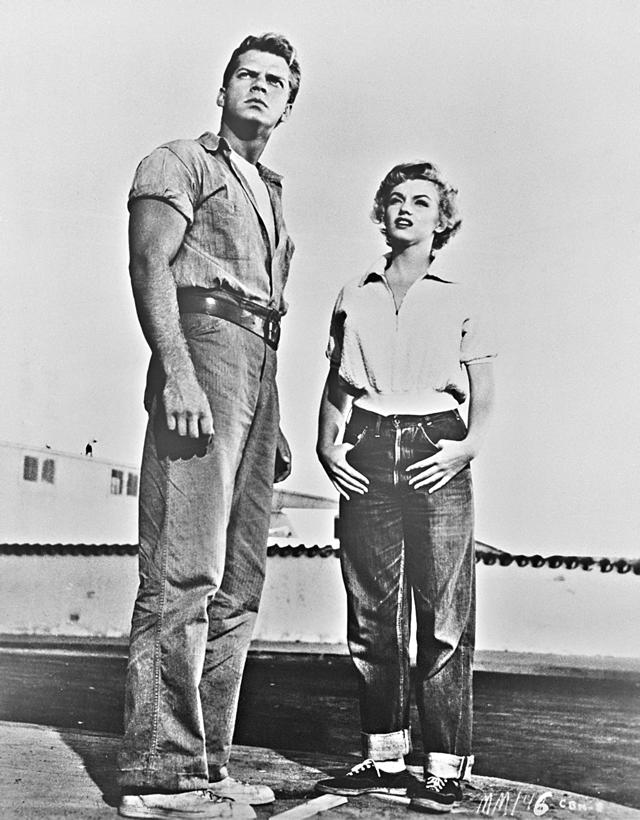 Keith Andes and Marilyn Monroe in Clash By Night (1952), wearing jeans in the boxy, workaday look of the time. (Getty Images) Keith Andes and Marilyn Monroe in Clash By Night (1952), wearing jeans in the boxy, workaday look of the time. (Getty Images)