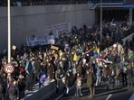 Extinction Rebellion activists and sympathisers block a busy road in The Hague, Netherlands. Extinction Rebellion activists and sympathisers block a busy road in The Hague, Netherlands.
