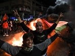 Palestinians celebrate in Gaza City on January 27, 2023, following a shooting attack by a Palestinian gunman outside an east Jerusalem synagogue.(AFP) Palestinians celebrate in Gaza City on January 27, 2023, following a shooting attack by a Palestinian gunman outside an east Jerusalem synagogue.(AFP)