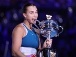 Belarus’ Aryna Sabalenka celebrates with the trophy after winning her final match against Kazakhstan’s Elena Rybakina 