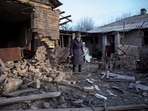 Local resident Yevheniia Yepifanova, 83, stands next to her house damaged by a Russian military strike, amid Russia's attack on Ukraine, in Chasiv Yar, Donetsk region, Ukraine. 