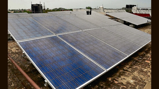 As part of the model, a private firm will be responsible for developing, installing, financing and operating the rooftop solar power plant for a limited build-operate-transfer (BOT) period, which will be decided during the tendering stage. (HT File Photo)