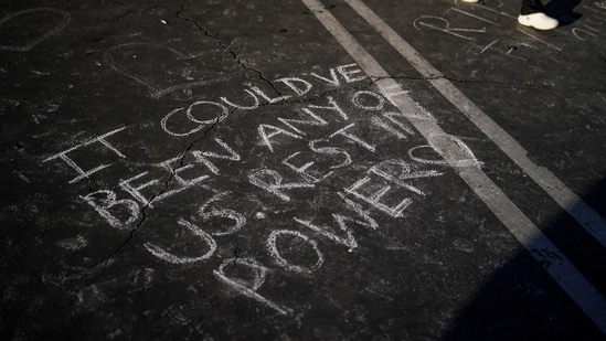 A message is written at a memorial outside Star Dance Studio for the victims killed in last week's mass shooting in Monterey Park, California. (AP)